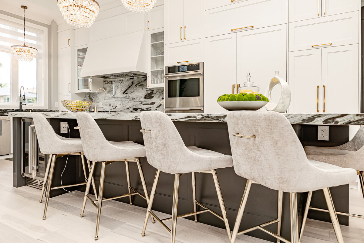 luxury kitchen island with bar stools marble countertop detail Toronto home photography