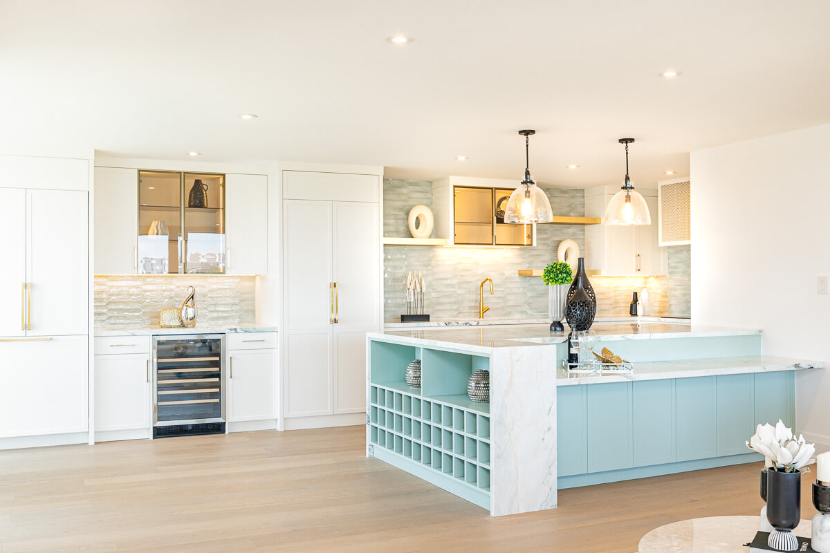 modern white kitchen with blue island Toronto real estate interior photography