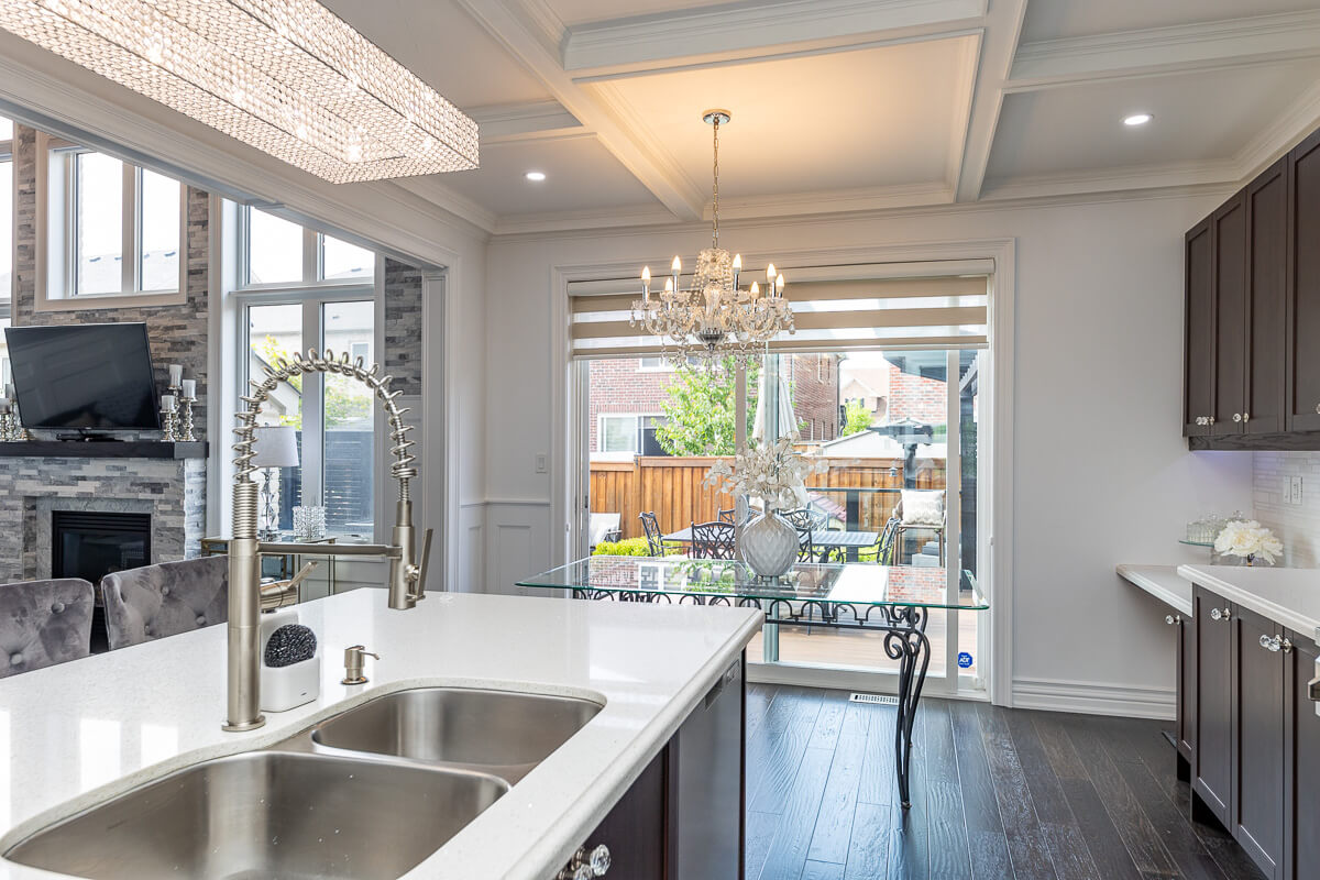 Open concept kitchen and dining area with large windows, Toronto real estate photography