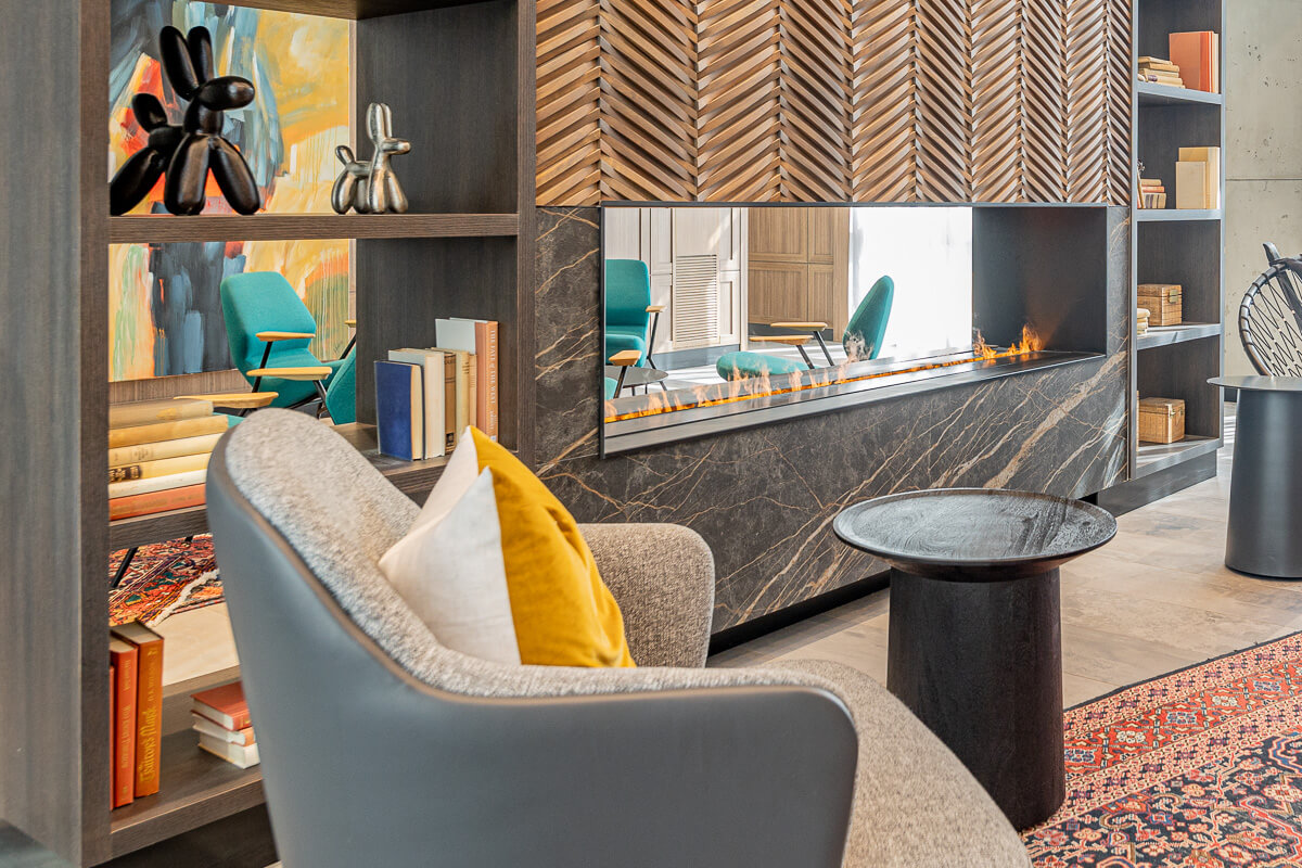 Modern fireplace with built-in shelves and decor, luxury home photography Toronto