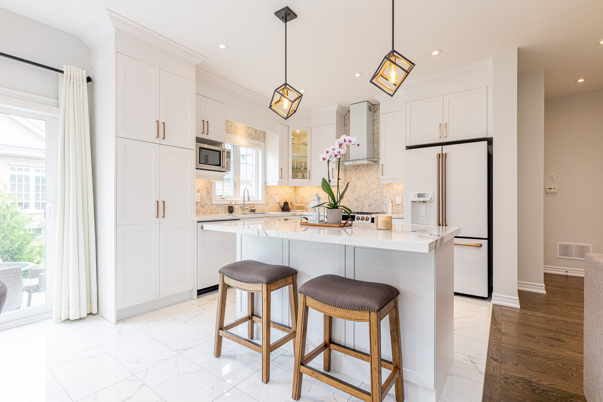 Modern kitchen with island and bar stools, professional real estate photography Toronto interior
