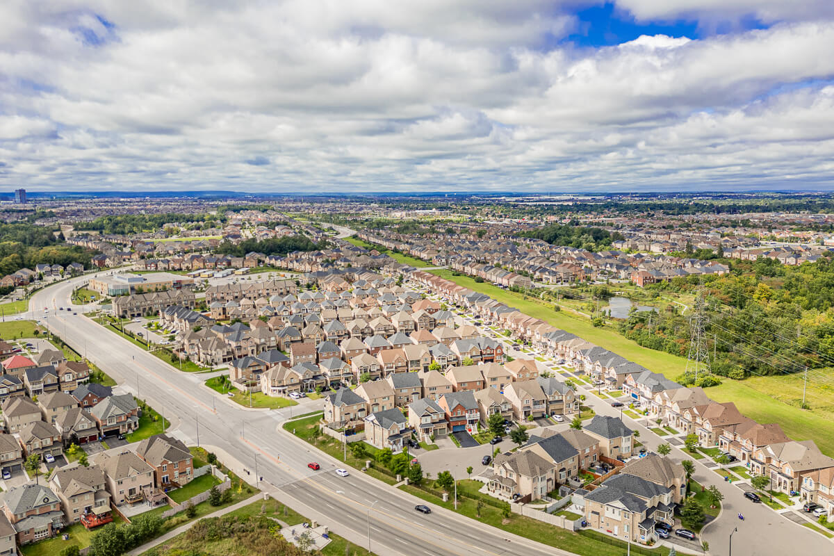Aerial view of suburban neighbourhood with houses and roads, real estate drone photography Toronto GTA