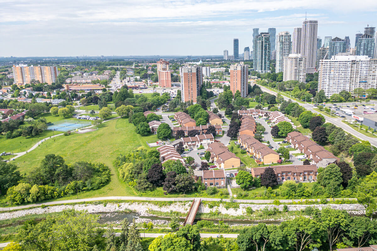 Aerial landscape with ponds and green fields near residential area, real estate drone photography Ontario