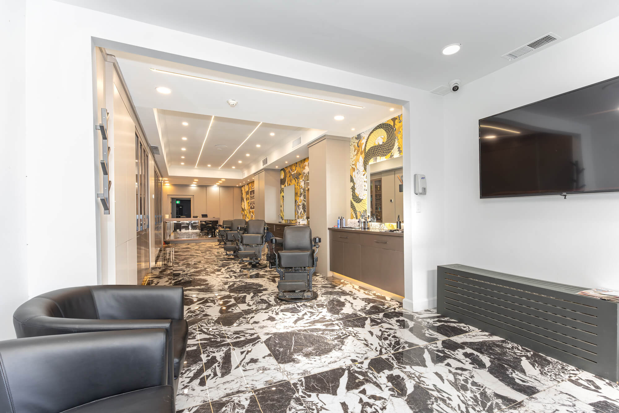 Retail interior photography in Toronto showing upscale barbershop design and storefront branding